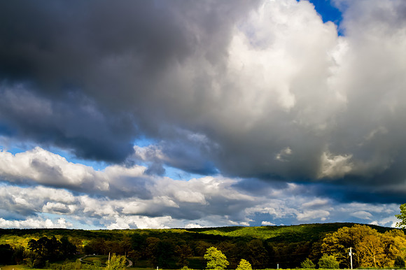 Clouds Over trees and hills